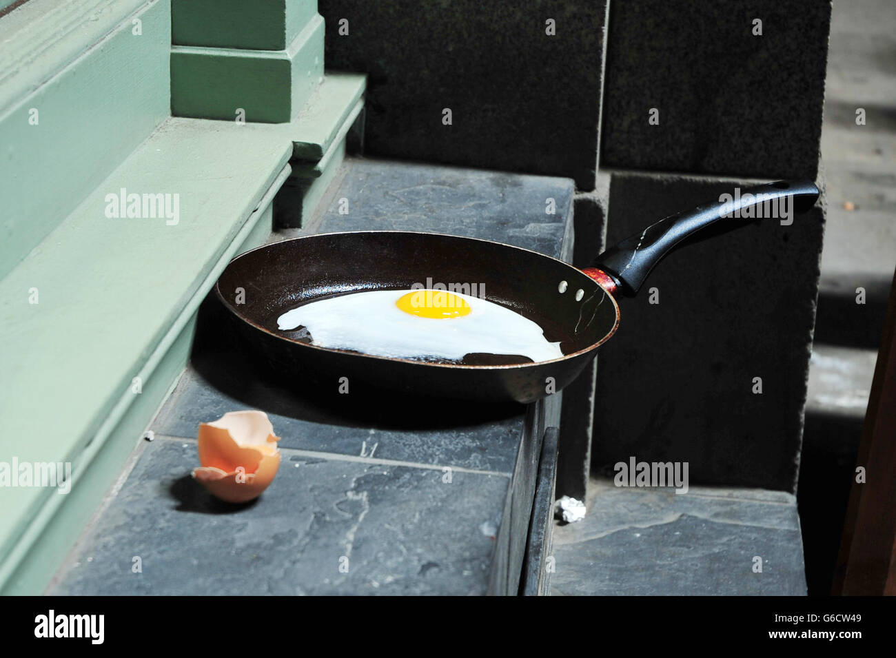 An egg is fried in intense sunlight reflected from the "Walkie-Talkie"  building, in Eastcheap in the City of London, where sun light reflected  from the building melted part of a Jaguar car