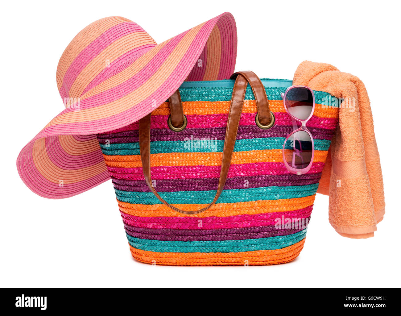 Colorful striped beach bag with a straw hat towel and sunglasses Stock ...