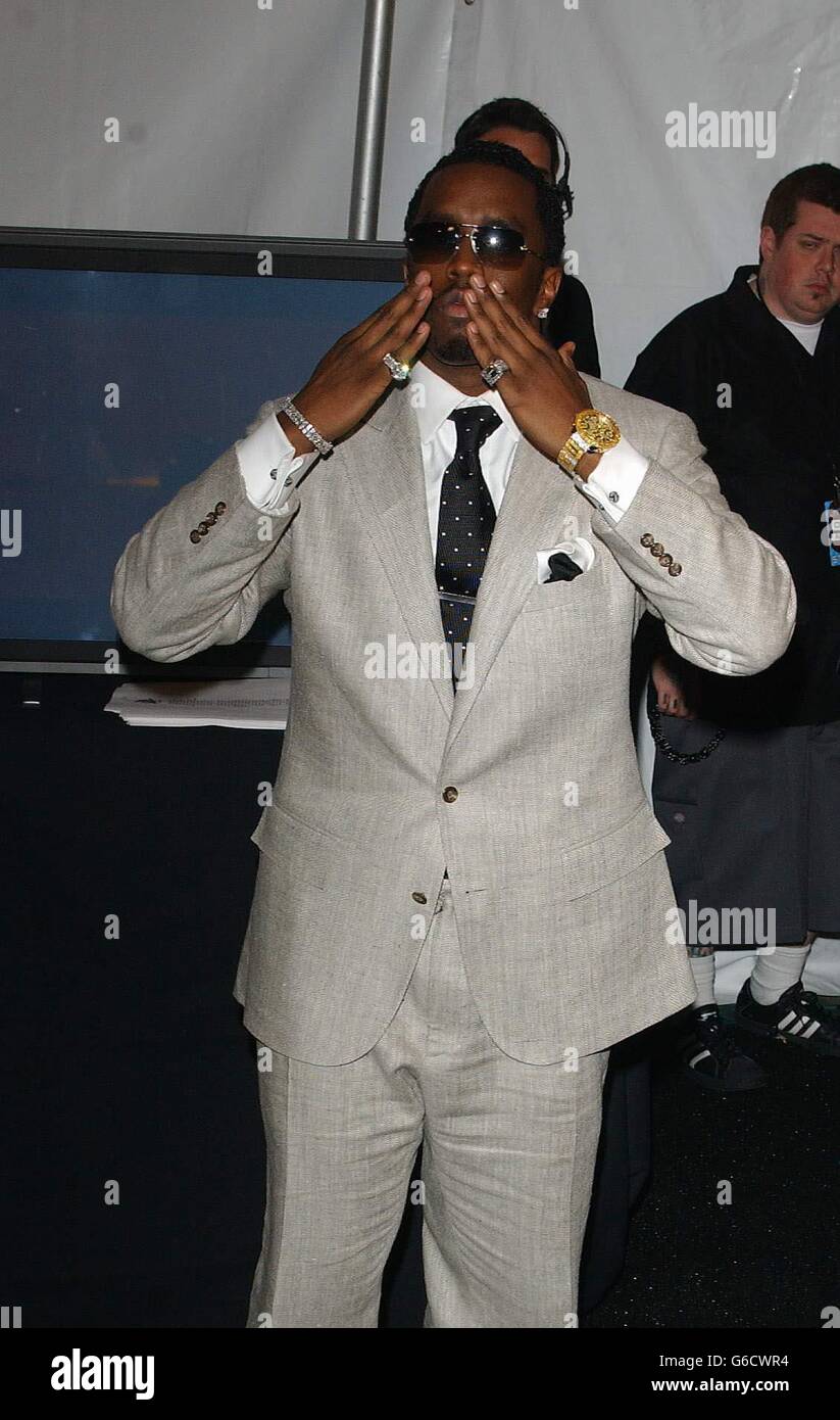 Awards celebrity singer grey suit hires stock photography and images