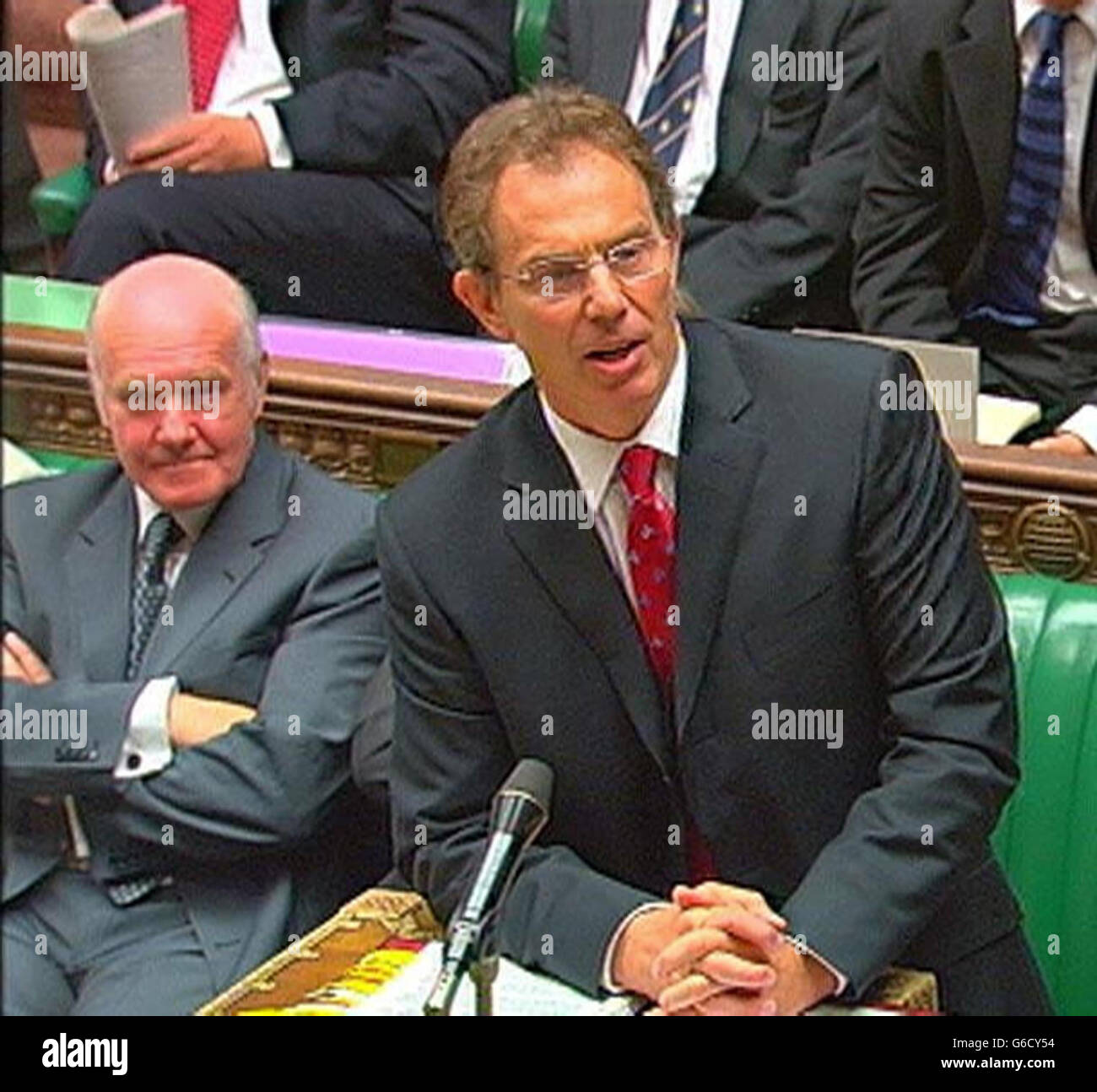 Leader of the House John Reid watches as Britain's Prime Minister Tony Blair answers a question in the House of Commons during his regular weekly session of questions from members of parliament. * Amongst other matters, he was expected to be quizzed over allegations that the Government exaggerated the threat of Iraq's weapons of mass destruction. Stock Photo