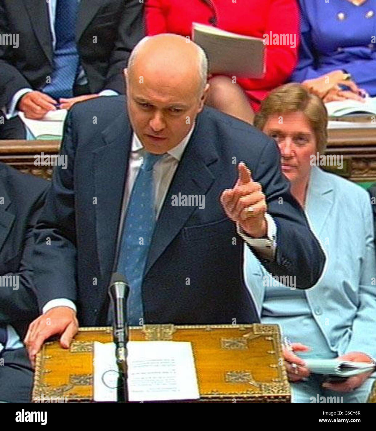Iain Duncan Smith, the leader of the Conservative party, puts a point to Prime Minister Tony Blair in the House of Commons during his regular weekly session of questions from members of parliament. * Amongst other matters, the PM was expected to be quizzed over allegations that the Government exaggerated the threat of Iraq's weapons of mass destruction. Stock Photo