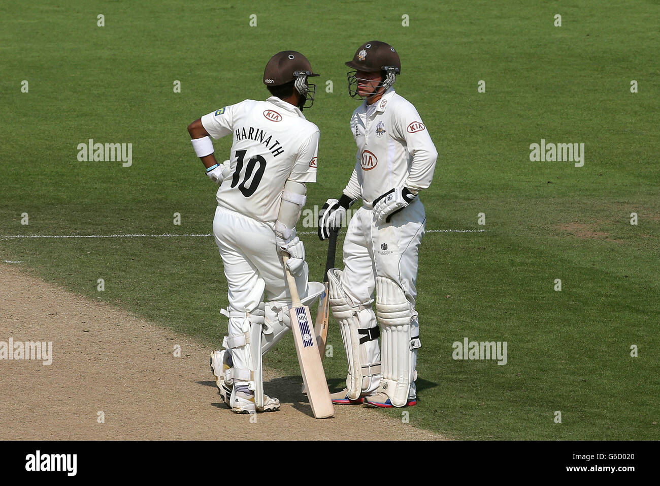 Surrey batsmen rory burns left and arun harinath hires stock
