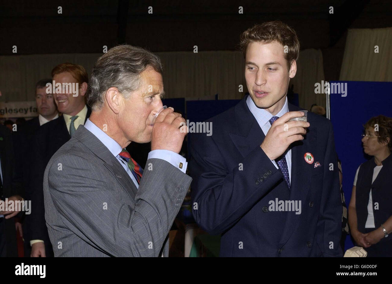 Prince William and his father the Prince of Wales, sample a drink, during a visit to the Anglesey Food Fair in north Wales. The Prince, and his father, Prince Charles, are in Wales for the day. Stock Photo