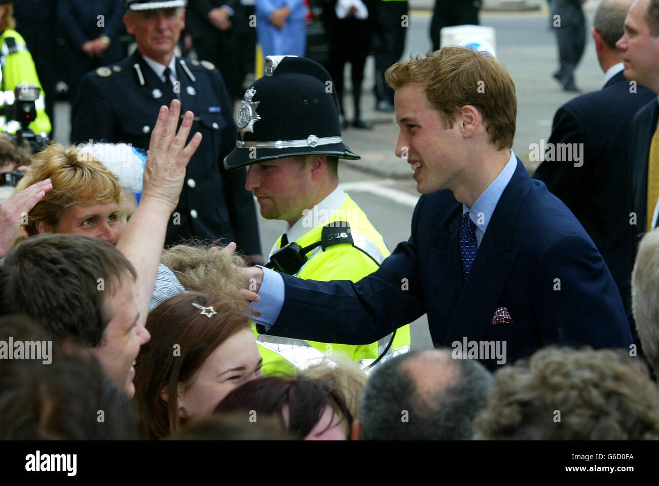 Prince William meets members of the public as he arrives at NASH (Newport Action for Single Homeless) in Newport South Wales, with his father Prince Charles.The visit was one of several arranged across the principality to mark the young prince's 21st birthday. Stock Photo