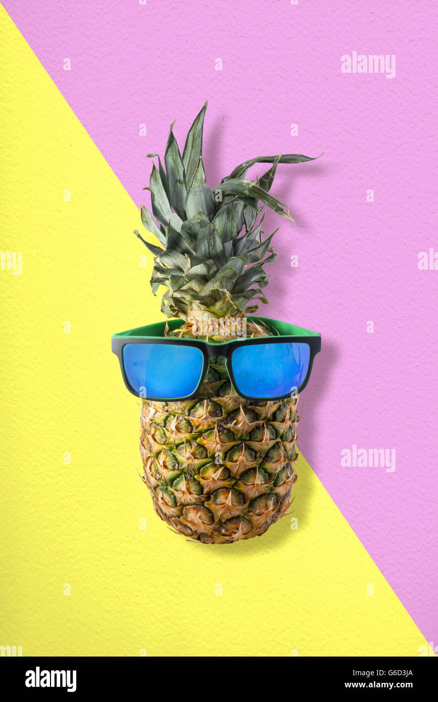 Tropical fruit pineapple wearing sunglasses hires stock photography