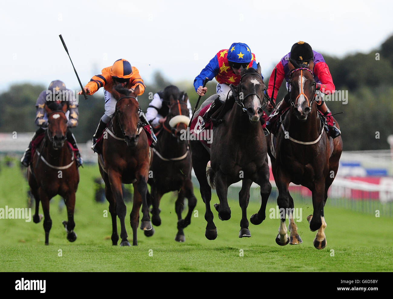 Kickboxer ridden by Paul Hanagan (second right) beats Musical Comedy ridden by Richard Hughes (right) to win the Betfred Treble Odds On Lucky 15s Nursery Handicap Stakes during the Betfred Sprint Cup Festival at Haydock Park Racecourse, Newton-le-Willows. Stock Photo