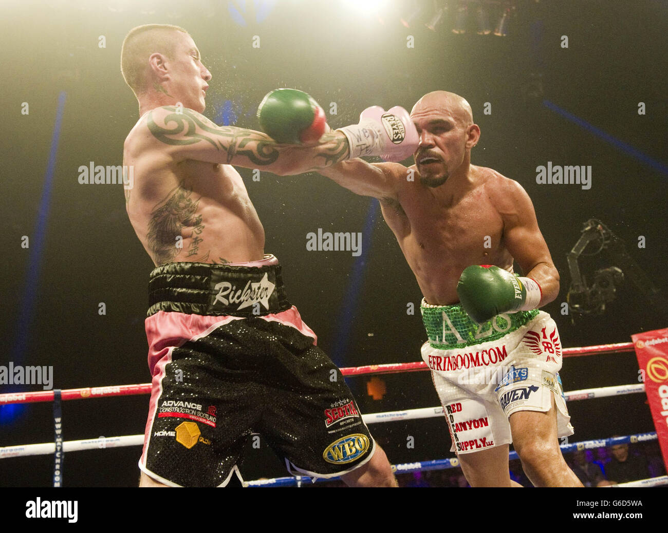 Ricky Burns and Raymundo Beltran during the WBO World Lightweight Title fight at the SECC, Glasgow. Stock Photo