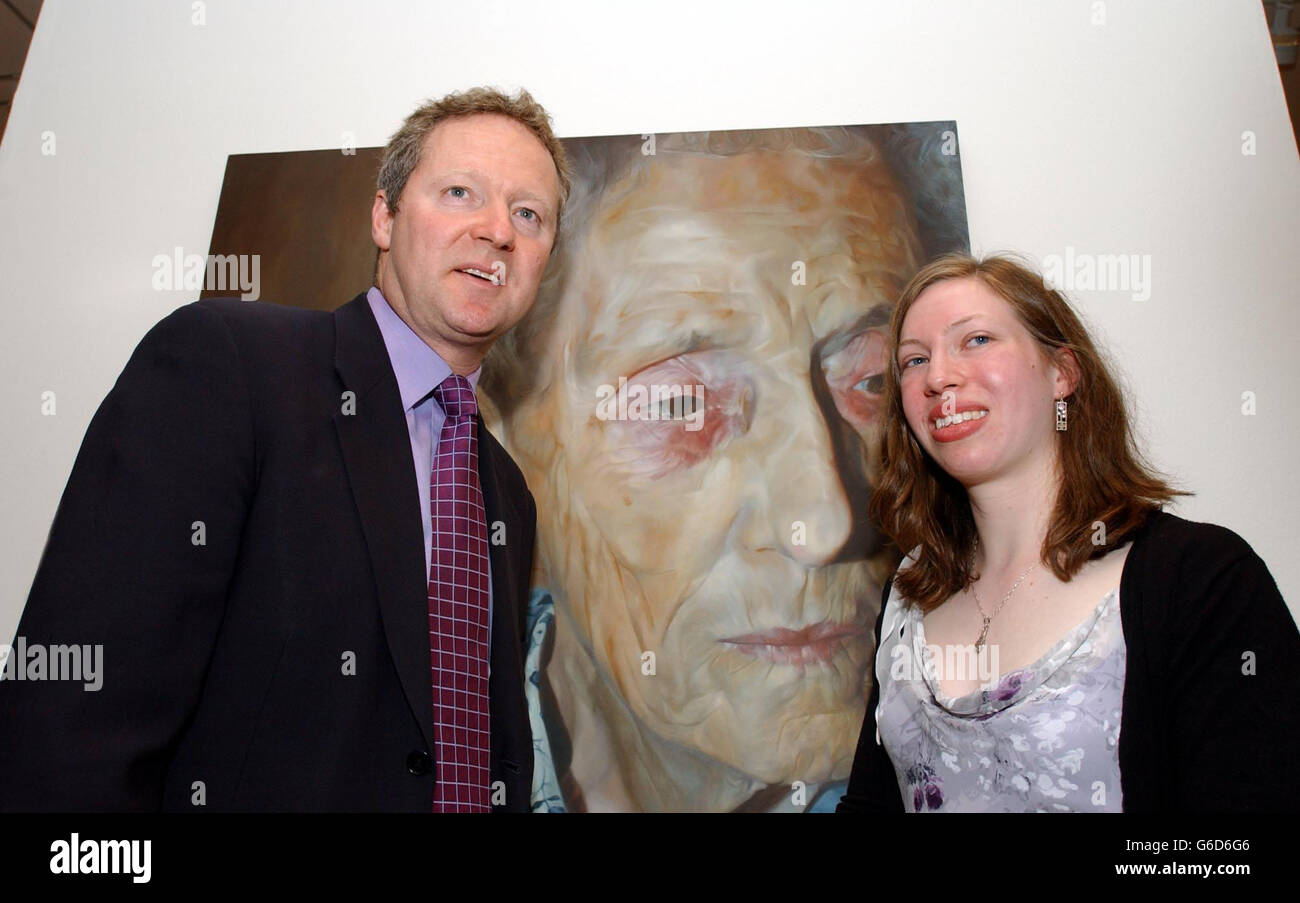 Rory Bremner and artist Charlotte Harris, 21, currently in her final year at Leeds Metropolitan University, stand in front of the portrait she painted of her grandmother Doris Davis, after she was named winner of the National Portrait Gallery's BP Portrait Award. * ......... for the painting of her 83-year-old grandmother. The prize is 25,000 plus a commission of 3,000 to paint a portrait for the Gallery's collection. Stock Photo