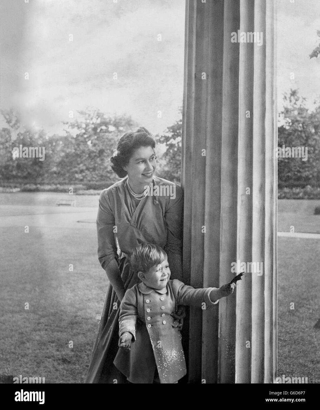 Prince Charles, 2, plays a game of hide-and-seek with his mother Princess Elizabeth. Stock Photo