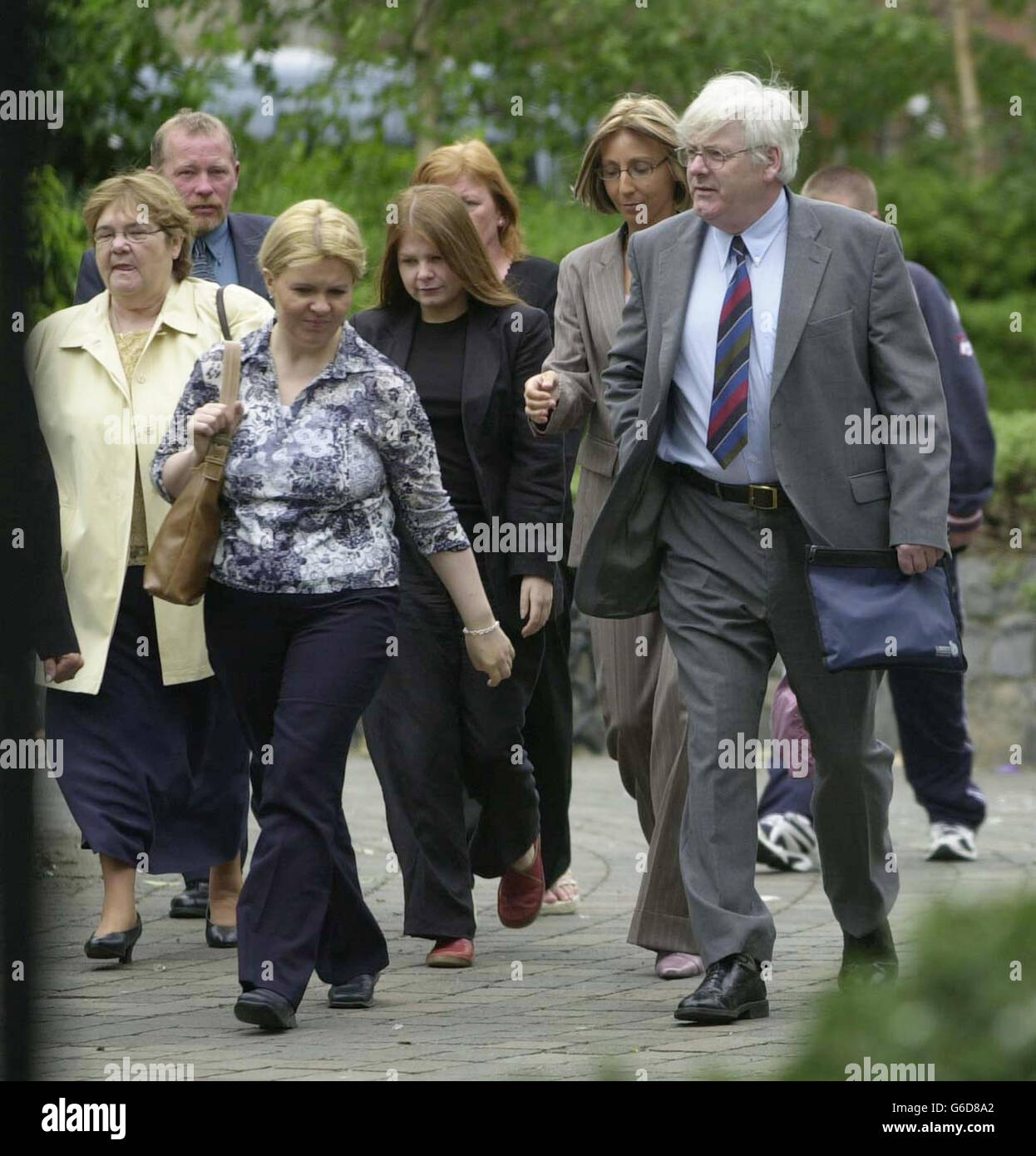 Spokesman for the Omagh Victims Support Group, Michael Gallagher (right) arrives with friends and relatives of those who died in the 1998 Omagh bombing, at the Special Criminal Court in Dublin where Michael McKevitt was standing trial, * accused of masterminding the organisation behind the attack which killed 29 people and two unborn babies. Michael McKevitt, 53, the first man to be charged in the Irish Republic with directing terrorism, is accused of directing the Real IRA between 1999 and 2001 and of being a member of the group. He denies the charges. Stock Photo
