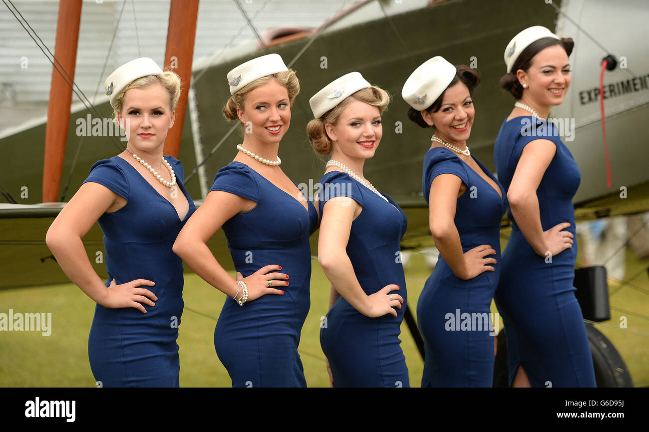 Goodwood Revival. Models in period style Air Hostess dresses pose