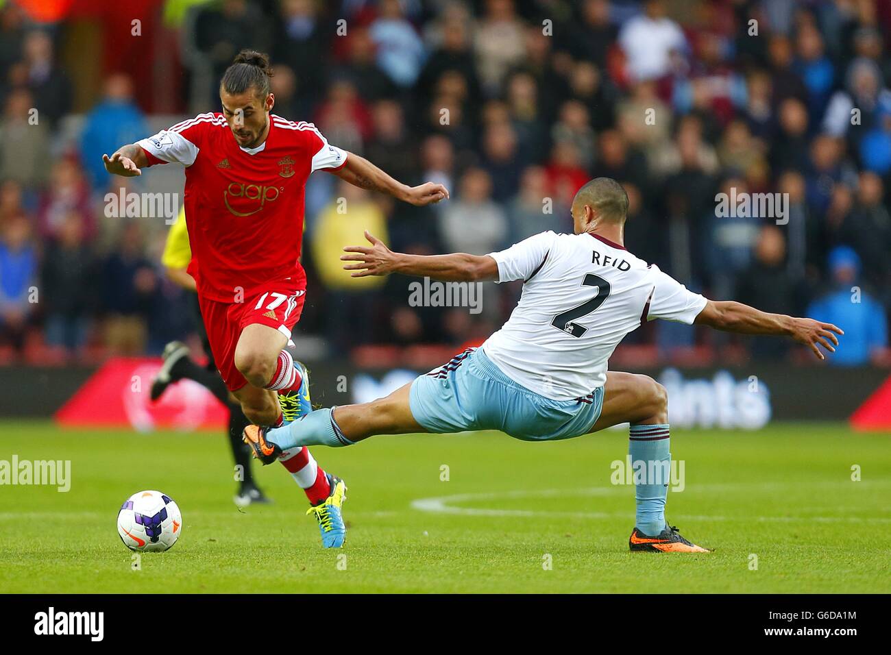 Southampton's Pablo Osvaldo (left) and West Ham United's Winston Reid battle for the ball Stock Photo