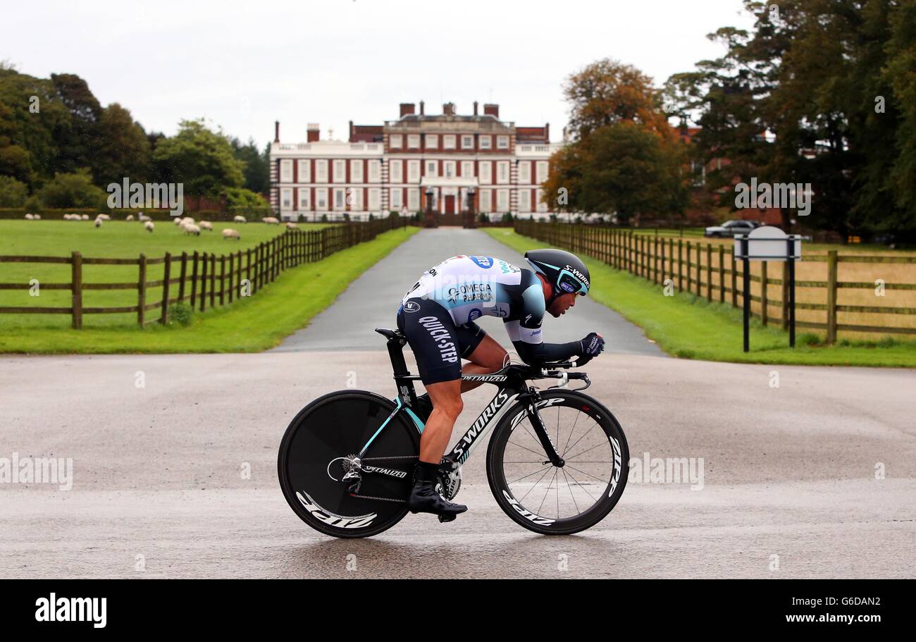 Omega-Pharma Quickstep's Mark Cavendish rides past Lord Derby's estate during the Stage Three Individual Time Trial in the 2013 Tour of Britain in Knowsley. Stock Photo