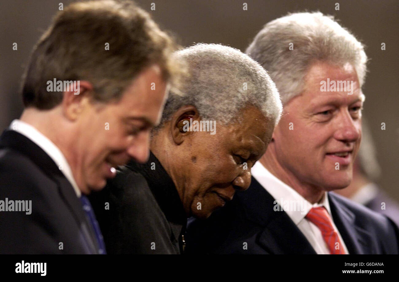 Former South African President Nelson Mandela (centre) is helped from ...