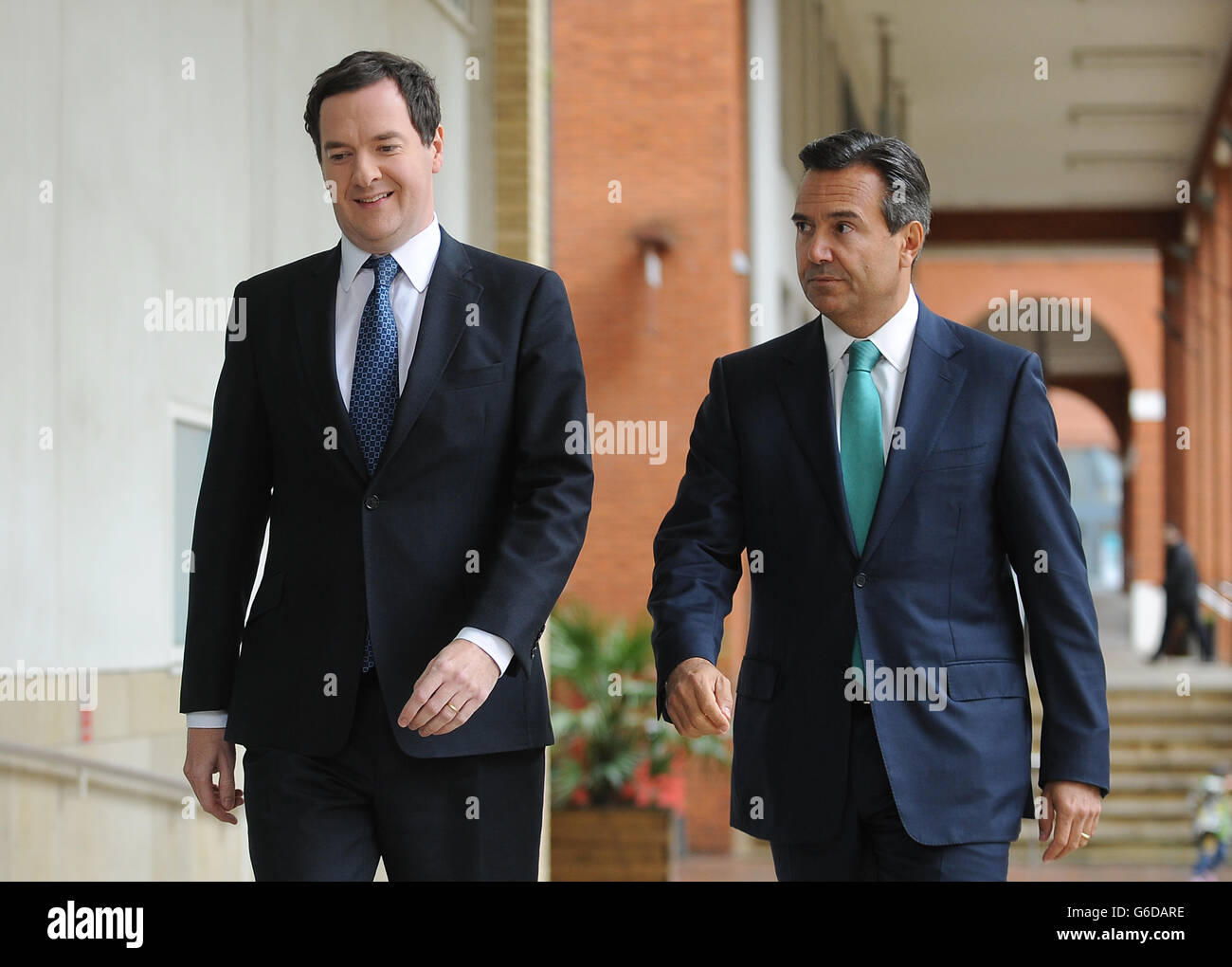 rio (right) and Chancellor Osborne (left) arrive to address