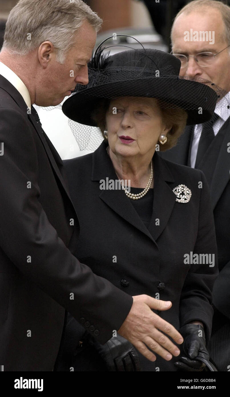 Former Prime Minister Baroness Thatcher stands with her son, Mark, at the Royal Hospital in Chelsea, west London before the funeral of her husband. Sir Denis, 88, died in the Lister Hospital, London on June 26 after a short illness. * In January he underwent a six-hour heart by-pass operation from which he seemed to be recovering, before falling ill again in mid-June. Stock Photo