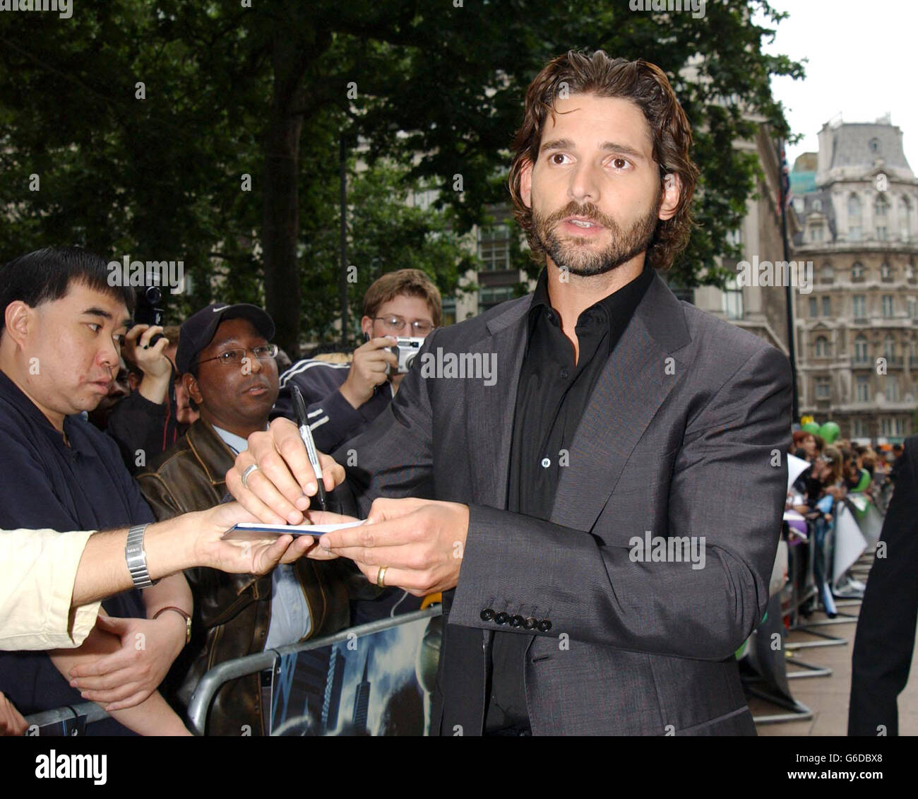 Eric Bana who plays the Hulk signs autographs as he arrives at the premiere of The Hulk at the Empire cinema in London's Leicester Square. Stock Photo