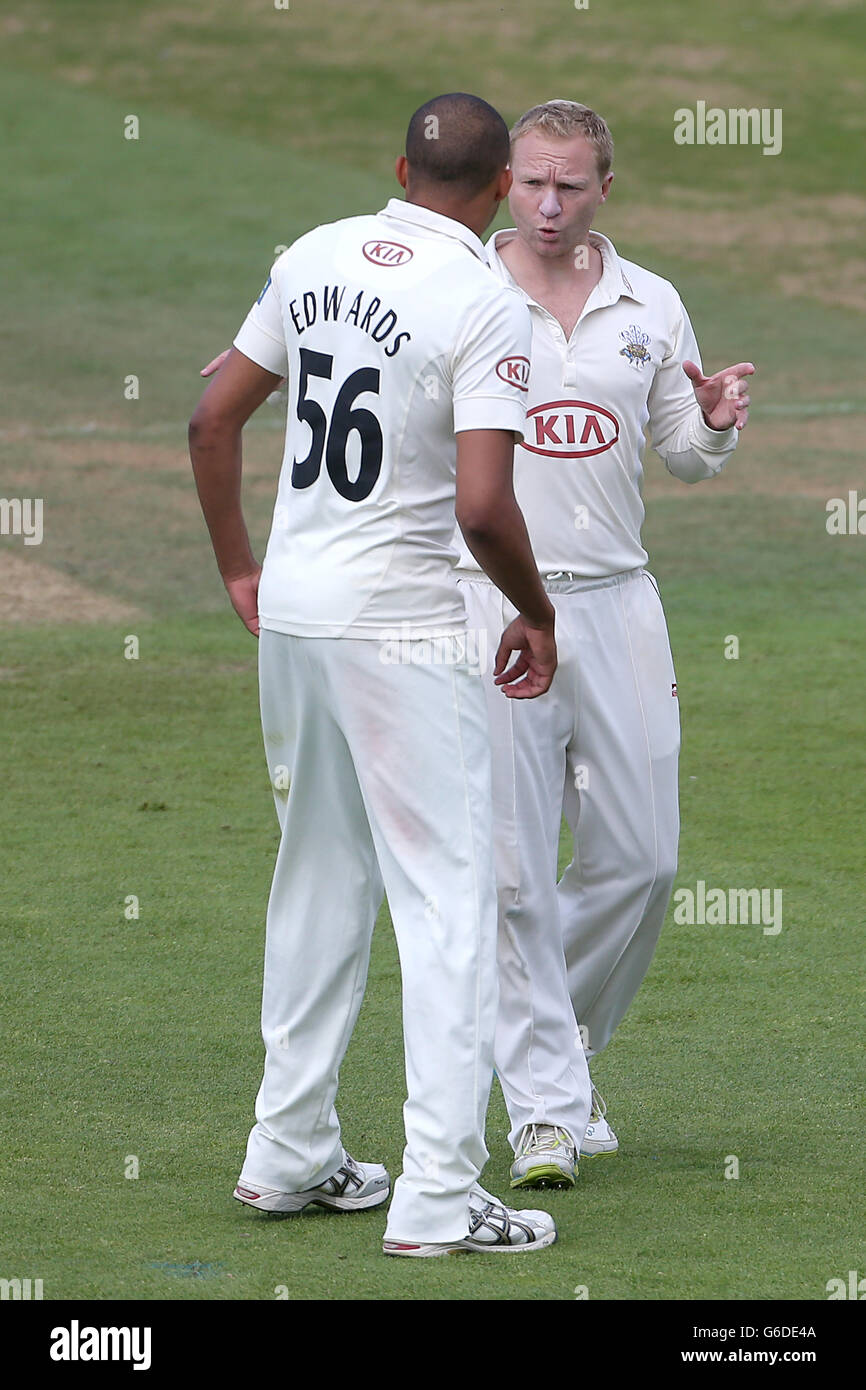 Surrey's Gareth Batty (right) speaks with teammate George Edwards Stock ...