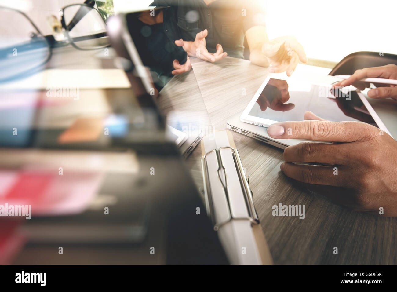Businessman making presentation with his colleagues and business tablet ...