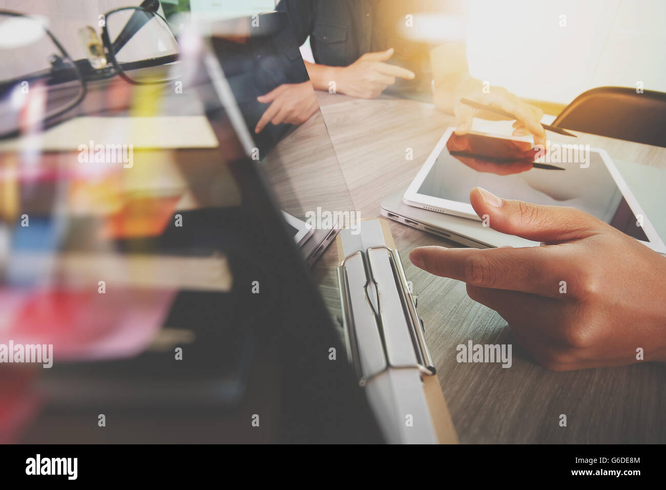 Businessman making presentation with his colleagues and business tablet ...