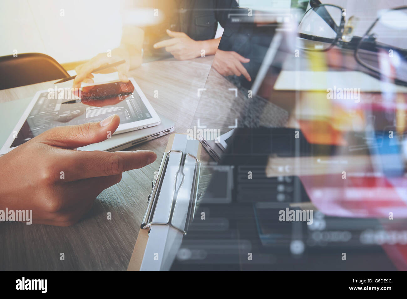 Businessman making presentation with his colleagues and business tablet ...