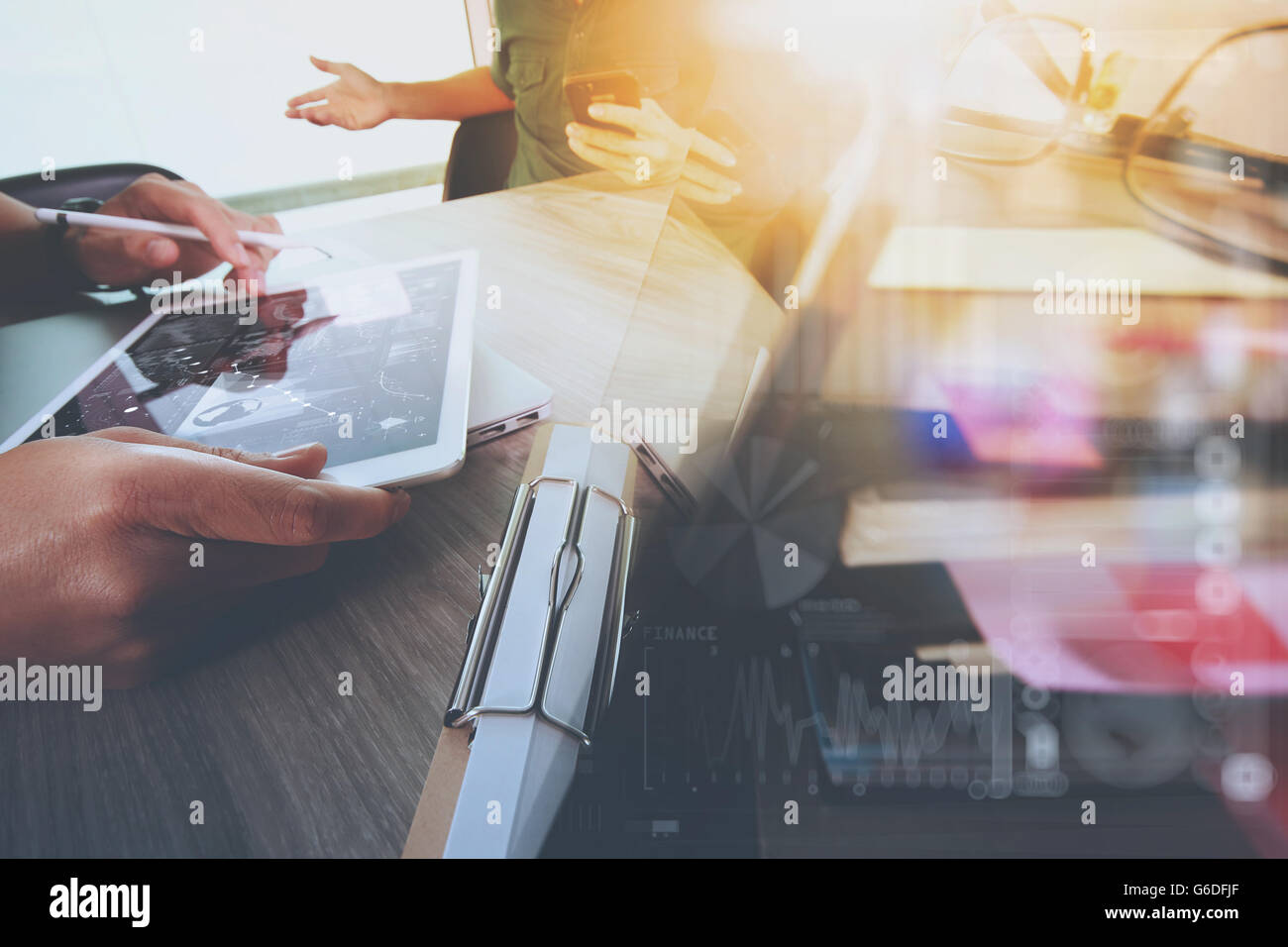 Businessman making presentation with his colleagues and business tablet ...