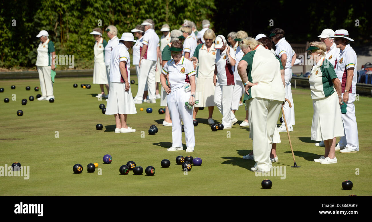Members of the Windsor and Eton Bowling Club enjoy a game of bowls in the afternoon sunshine in Windsor, Berkshire. Stock Photo