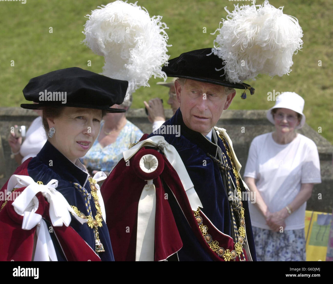 Britain s Princess Royal and the Prince of Wales walk down from Windsor Castle to St George's Chapel, for the annual Ceremony of the Garter procession. * The Garter is Britain s highest honour bestowed by the Queen on men and women for outstanding achievement and service to the nation. For fans of pomp and ceremony, the splendour of Garter Day at Windsor Castle is hard to beat. Stock Photo