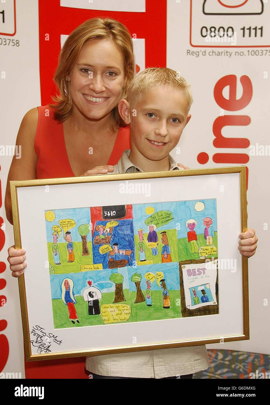 Peter Reid, 11, from Buckie, Moray, with BBC TV news presenter Sophie Raworth, and his award winning cartoon which he entered in the Childline Cartoon Crazy competition, at the natural History Museum in central London. *..The ChildLine competition was run in conjunction with Kellogg's as part of the Helping Kids Grow campaign, which has raised almost 1 million since it was set up in 2000. Stock Photo