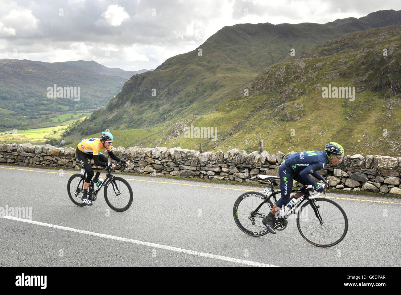 Team Sky's Bradley Wiggins follows Movistar's Nairo Quintana as they approach the top of Pen-Y-Pass with the Snowdon Massif in the background during the Stage Four of the 2013 Tour of Britain from Stoke to Llanberis. Stock Photo