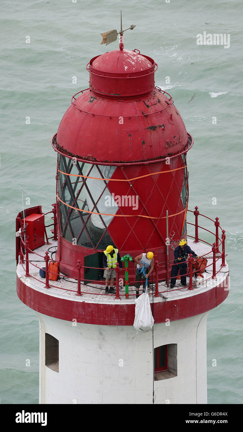 (PICTURE SHOT YESTERDAY)Workmen haul up paint and equipment to the top of Beachy Head Lighthouse near Eastbourne, Sussex, as contractors start the process of repainting the structure following a successful fund raising campaign to save the stripes. Stock Photo