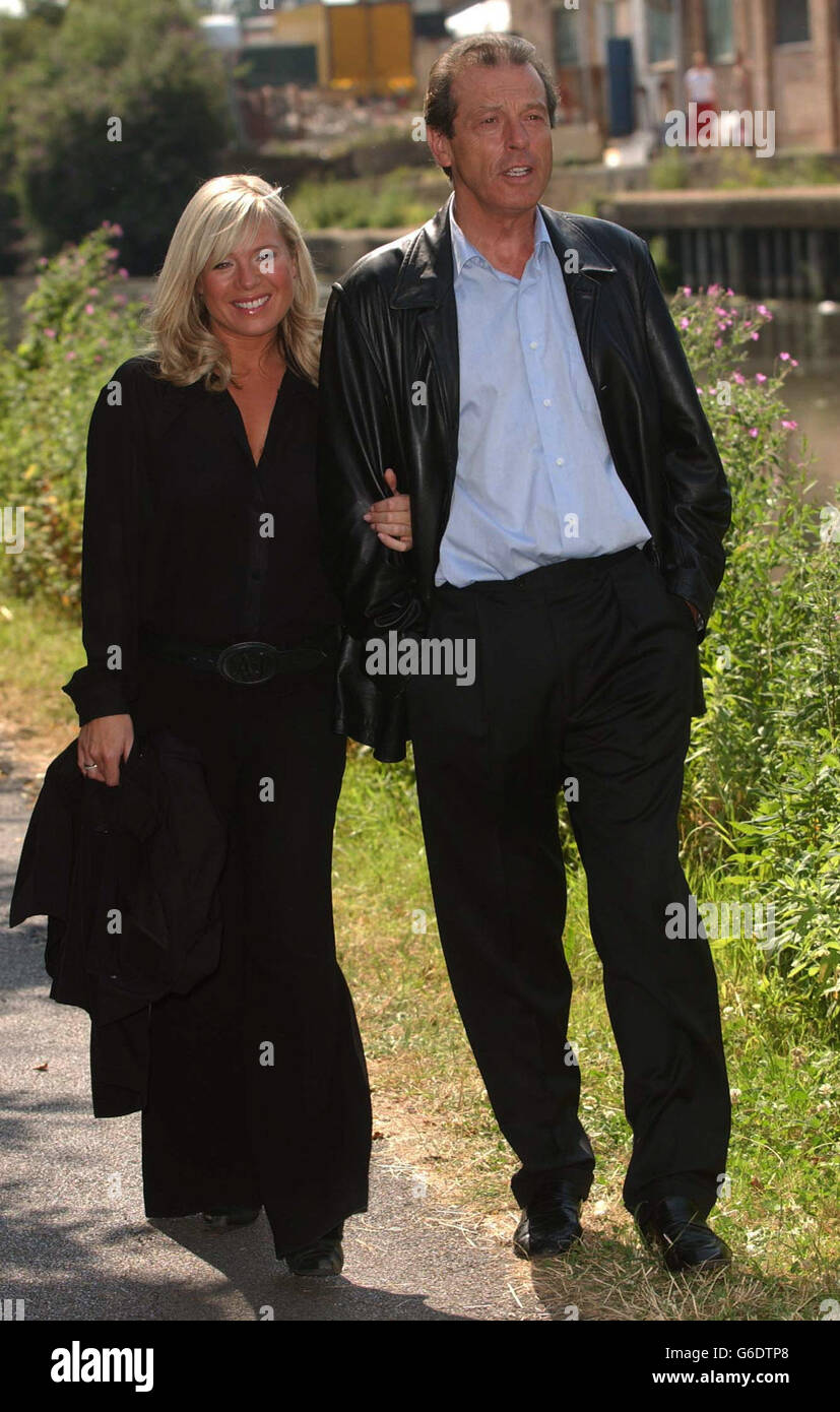 Actor Leslie Grantham with actress Letitia Dean during a photocall to introduce the return of his character 'Dirty Den', to the BBC soap Eastenders, in Alperton, London. Grantham left the programme in 1989. Stock Photo