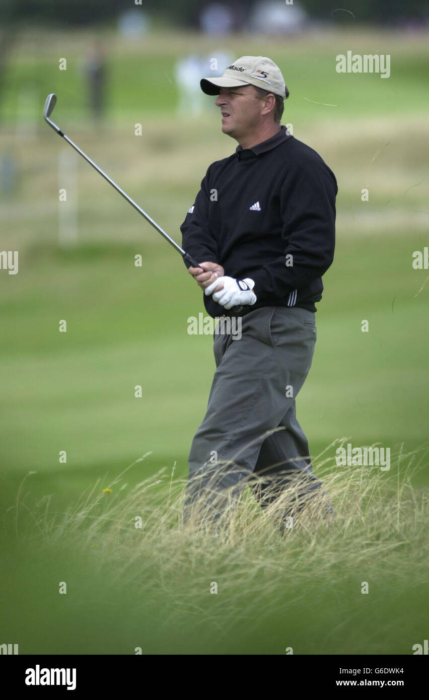 English golfer, Gary Emerson, plays out of the rough on the eighteenth