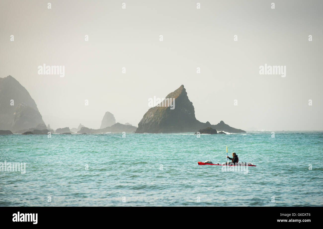 A kayaker approaches the shore of Navarro Beach in Elk, Calif., on March 31, 2014. Stock Photo