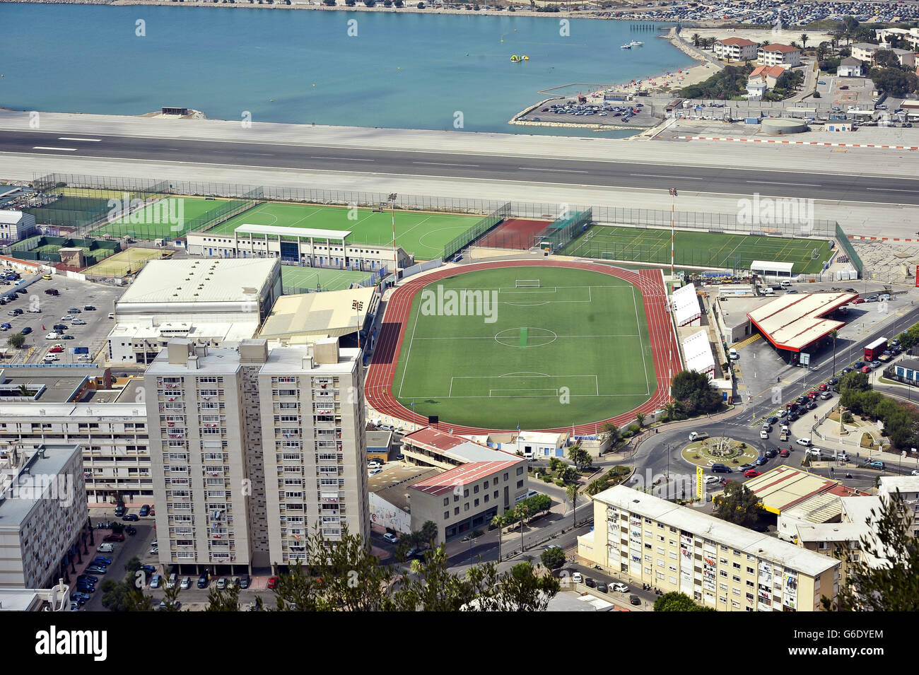 A general view of the Gibraltar runway with football pitches and sports facilities below. Stock Photo