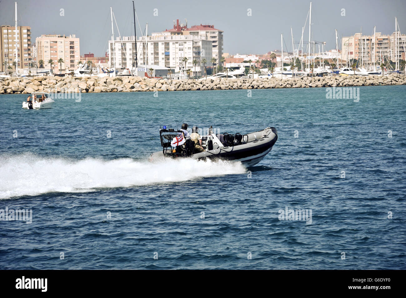 A Royal Navy rib patrols in Bristish waters around Gibraltar with Spain in the background. Stock Photo