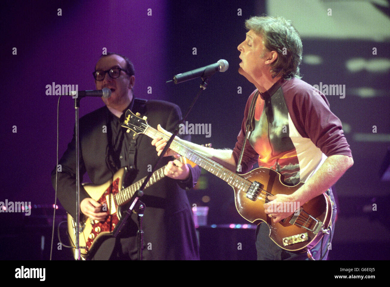 Elvis costello left and sir paul mccartney perform during here hires