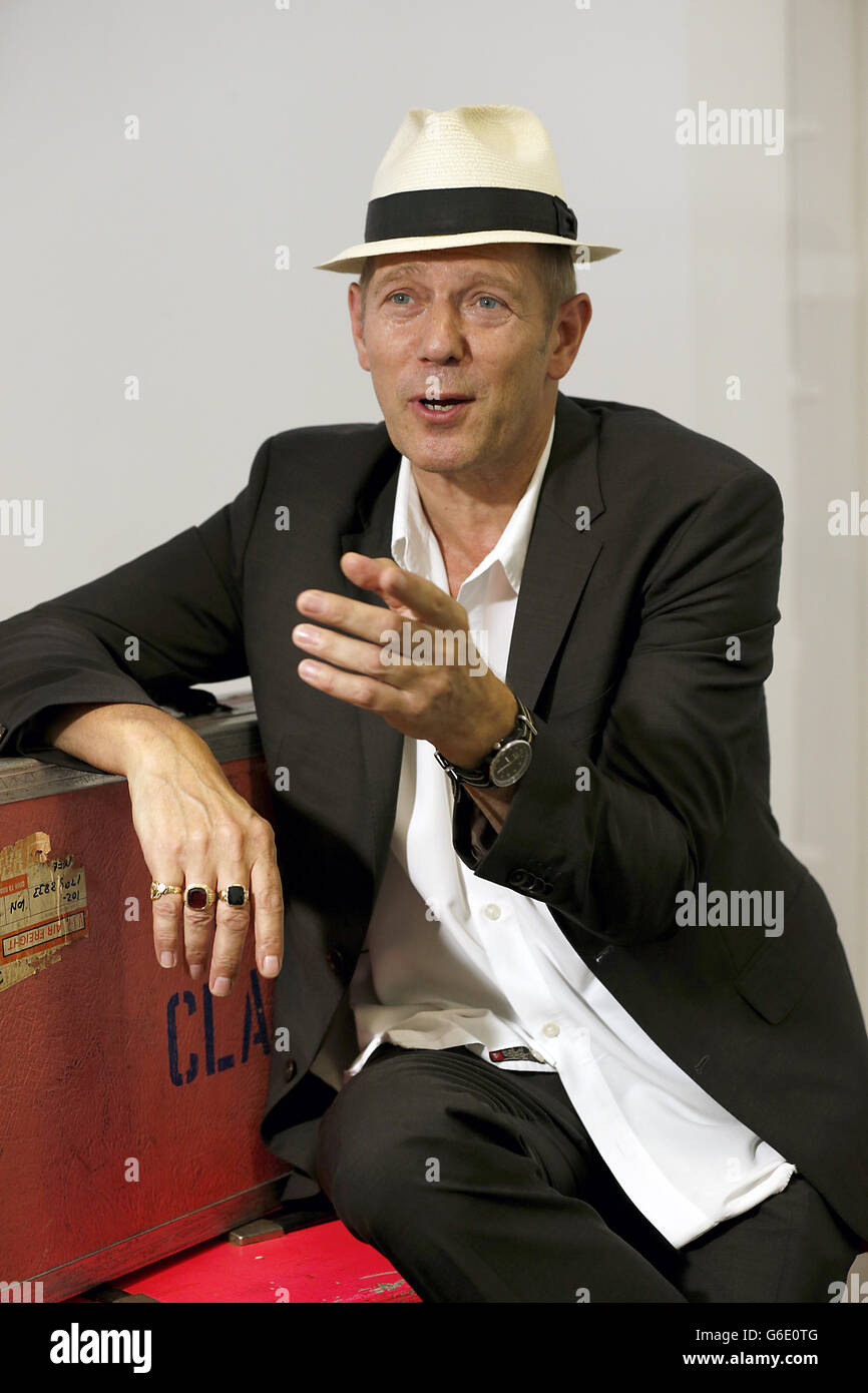 The Clash bassist Paul Simonon attends a photocall at the Black Market Clash popup exhibition