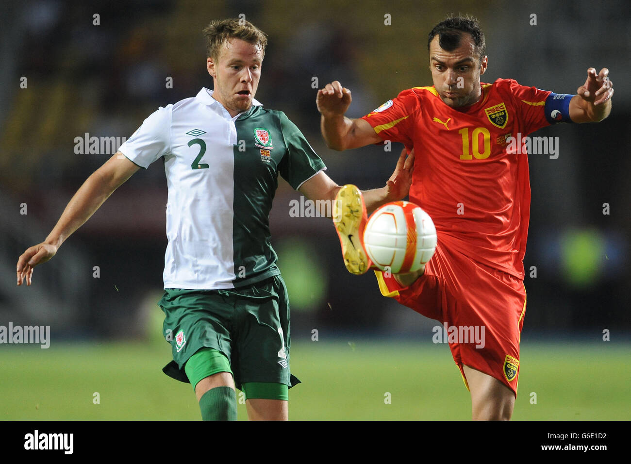 Wales' Chris Gunter (left) and Macedonia's Goran Pandev (right) battle for the ball during the World Cup Qualifying, Group A match at the Phillip II Arena, Skopje, Macedonia. Stock Photo