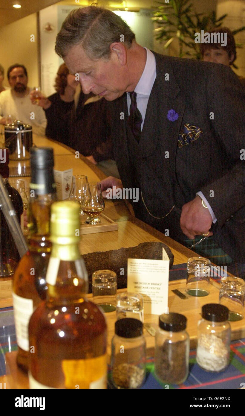 The Prince of Wales samples a dram of Ardbeg whiskey whilst on a tour of the Scotch Whiskey Heritage Centre on the royal mile to celebrate British Tourism as part of Royal Tourism Day. Stock Photo