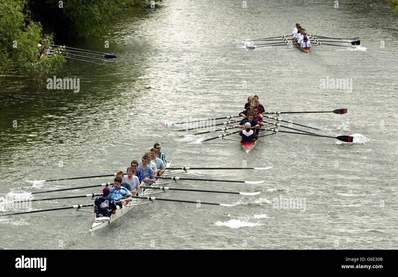 Rowing eights in the Fifth Men's Division compete, in the May Bumps on