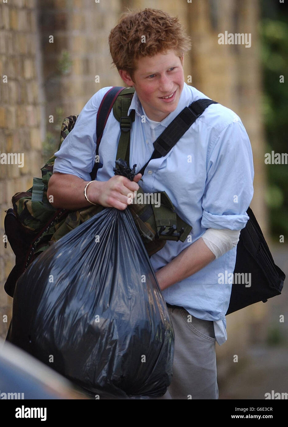 Prince Harry, the younger son of the Prince of Wales, carries his belongings to a car as he leaves Eton College on his last day at the top public school where he has been a pupil for five years. * Like his older brother William, Harry has spent his Eton schooldays boarding at Manor House, on the site of the lodgings of probably the most famous Old Etonian of them all, victor of Waterloo, the Duke of Wellington. It has been announced that Prince Harry is to apply for entry to the Royal Military Academy at Sandhurst. Stock Photo