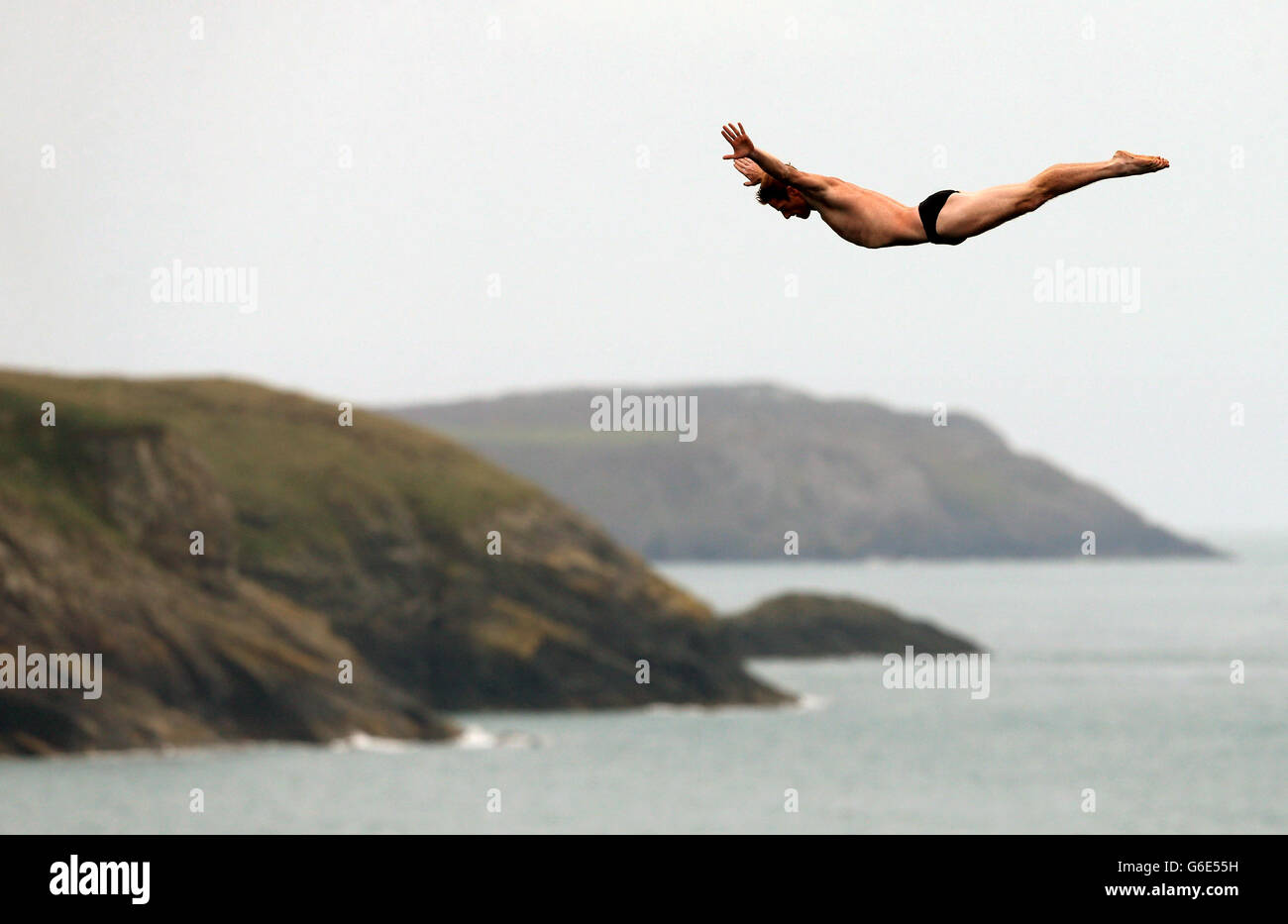 USA's Andy Jones during day one of the Red Bull Cliff Diving World Series at the Blue Lagoon in Abereiddy. Stock Photo