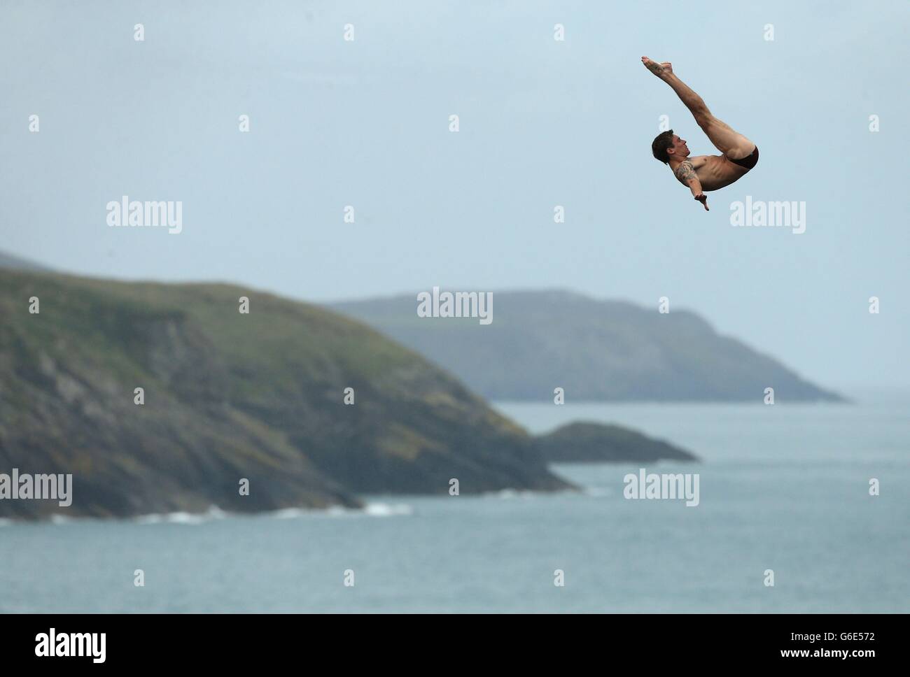 Sport - Red Bull Cliff Diving World Series - Day One - Blue Lagoon. England's Matt Cowen during day one of the Red Bull Cliff Diving World Series at the Blue Lagoon in Abereiddy. Stock Photo