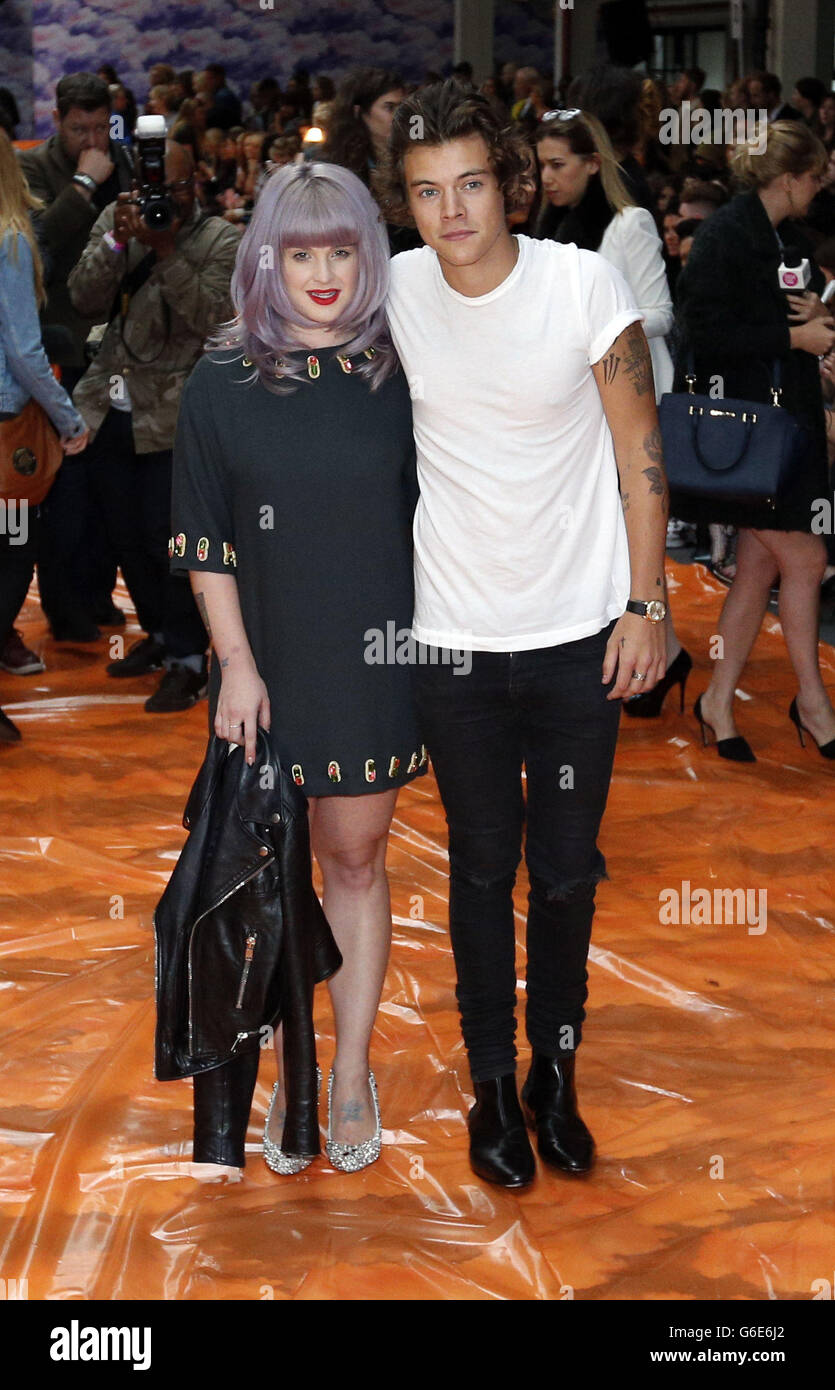 Harry Styles and Kelly Osbourne arriving at the House of Holland Spring/Summer 2014 show at the BFC Showspace, Somerset House, London as part of London Fashion Week. Stock Photo