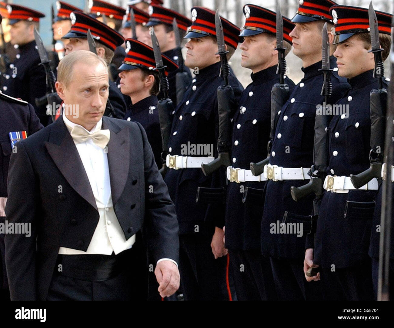 Russian President Vladimir Putin inspects an honour guard drawn from the Honourable Artillery Company at the Guildhall in London where the President and his wife, Lyudmila, are attending, a banquet hosted by the Lord Mayor of London. Stock Photo