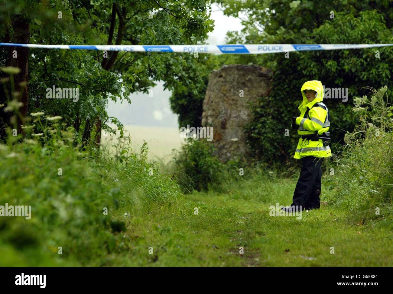 A female police officer stands in the lane where 14-year-old Jodi Jones' body was found. The schoolgirl's body was discovered in a wooded area behind a school in Dalkeith, Midlothian. * Detective Superintendent Craig Dobbie. who is leading the investigation, told a media briefing that the violent death was discovered by family members who had alerted police to her disappearance. Stock Photo