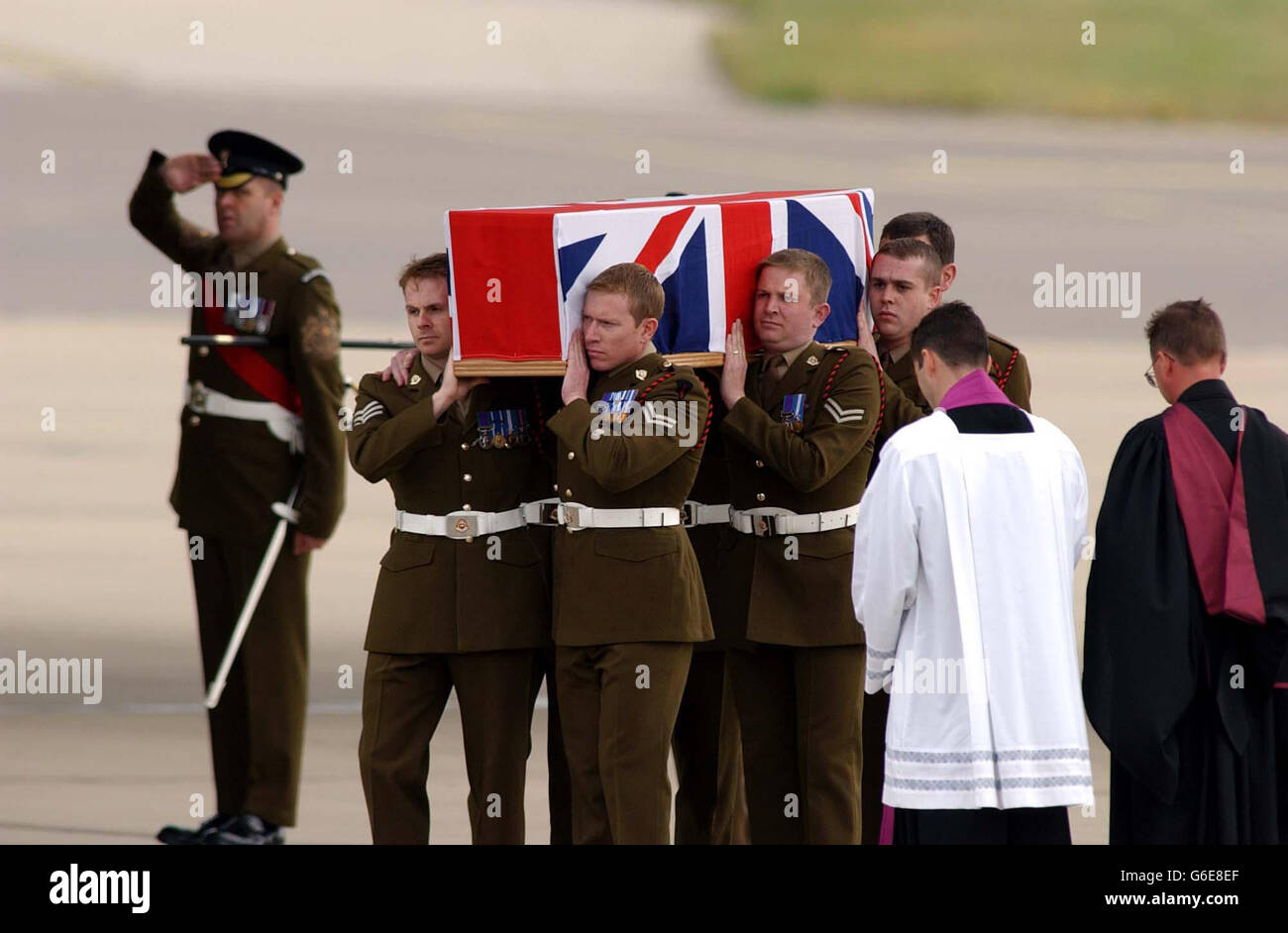 The coffin of Sergeant Simon Hamilton-Jewell, one of the six British Royal Military Policemen killed in an attack at Al Majar al-Kabir in southern Iraq last month, is carried from an RAF aircraft at a repatriation ceremony at RAF Brize Norton, Oxfordshire. * As well as the six men's family and relatives, Defence Secretary Geoff Hoon and Chief of the General Staff, General Sir Mike Jackson were at the air base. Stock Photo