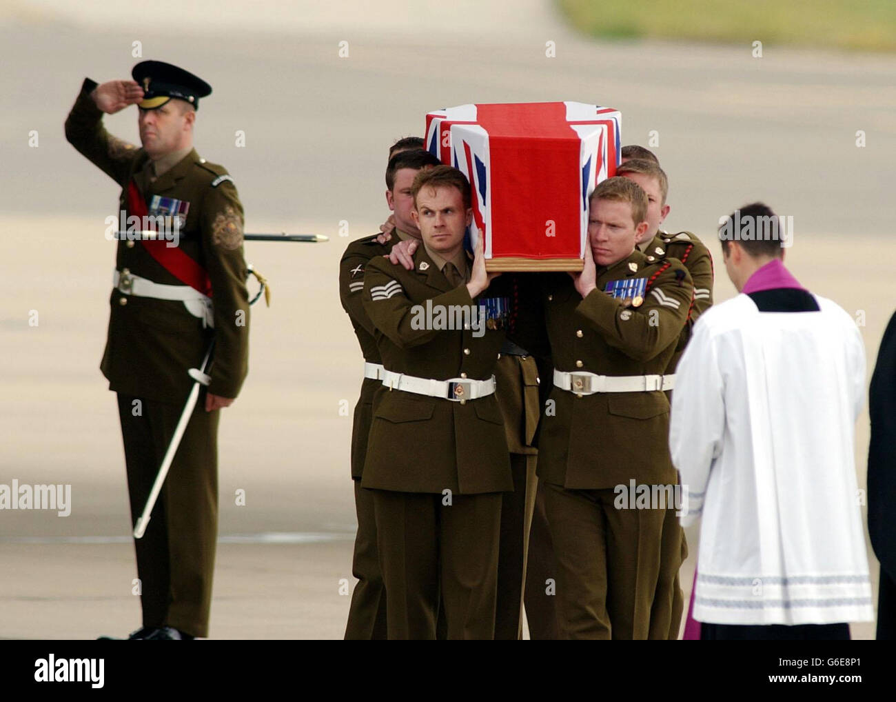 The coffin of Sergeant Simon Hamilton-Jewell, one of the six British Royal Military Policemen killed in an attack at Al Majar al-Kabir in southern Iraq last month, is carried, from an RAF aircraft at a repatriation ceremony at RAF Brize Norton, Oxfordshire. * As well as the six men's family and relatives, Defence Secretary Geoff Hoon and Chief of the General Staff General Sir Mike Jackson were at the air base. Stock Photo