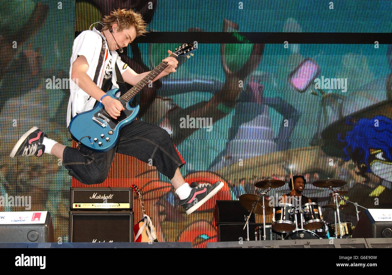 Busted performing on stage at the Capital Radio Party in the Park, in Hyde Park, London. The concert is being held in aid of The Prince's Trust Stock Photo